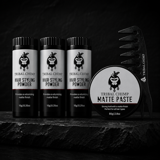Tribal Chimp hair styling products including powder and paste on a dark background