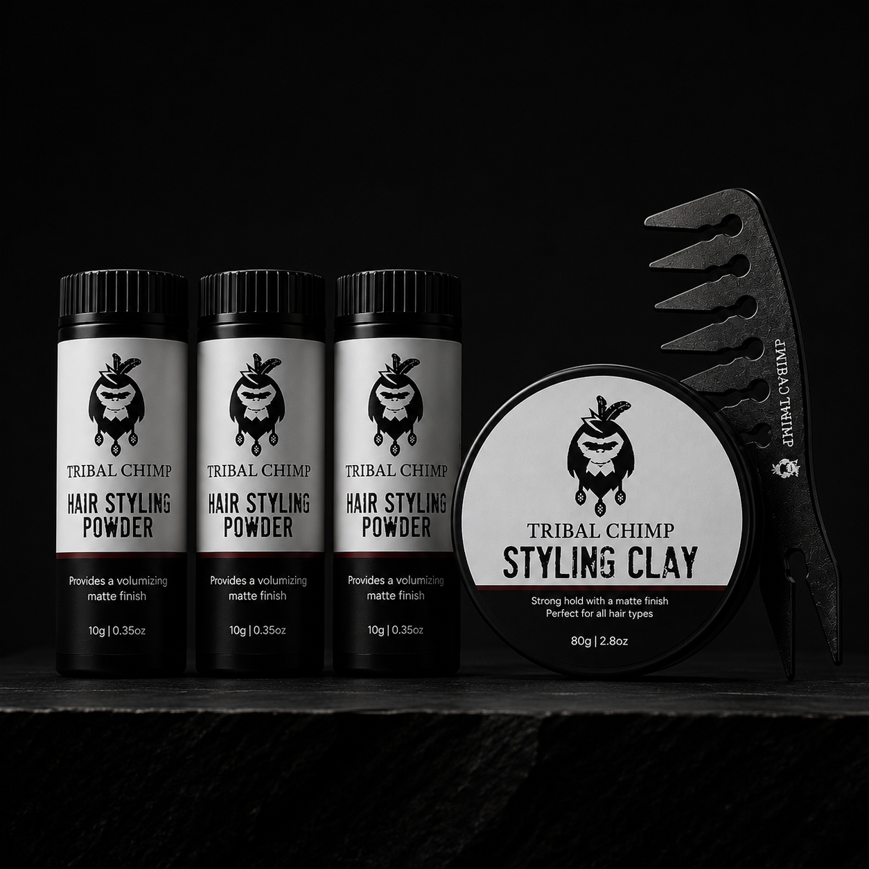 Tribal Chimp hair styling products including powder and clay on a black background