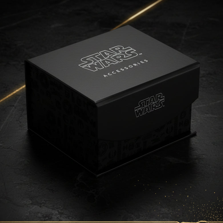 Black Star Wars accessories box with branding on a black background with gold stripes. 