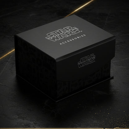 Black Star Wars accessories box with branding on a black background with gold stripes. 