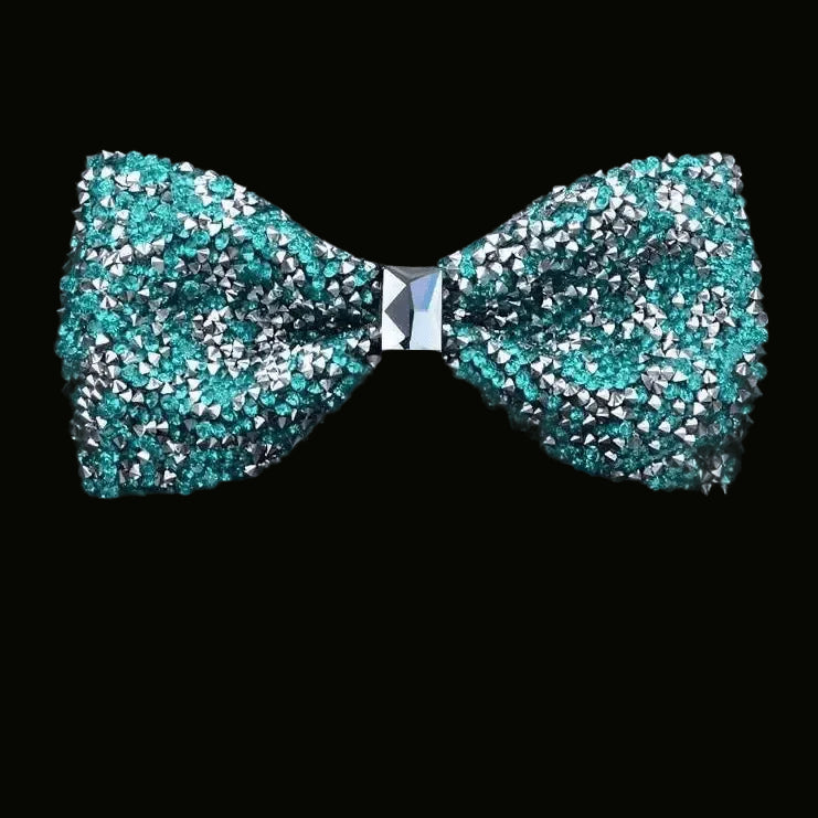 Turquoise bow tie with rhinestone embellishments on a black background