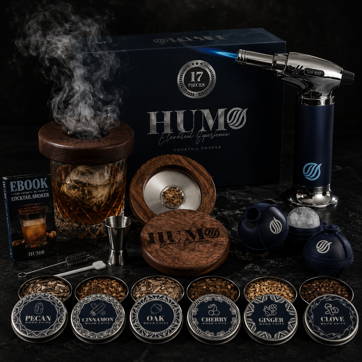 Cocktail smoker set with smoking device, wood components, and various flavor options on a dark background.