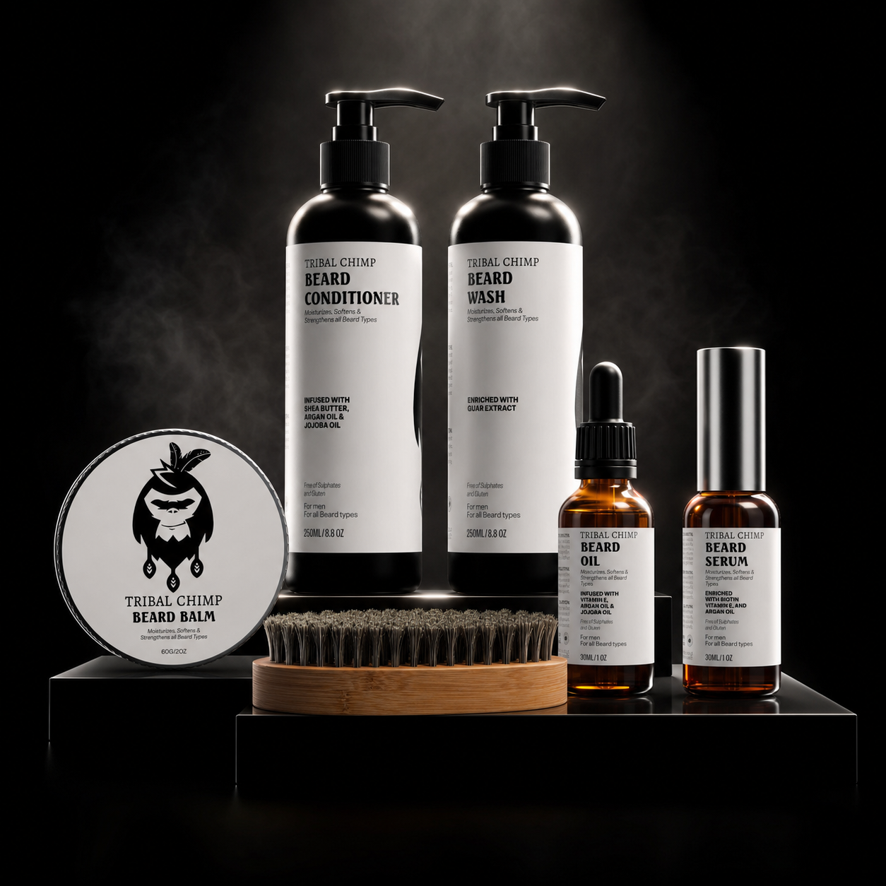Collection of Tribal Chimp beard care products including bottles, balm, and brush on a dark background.