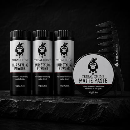 Tribal Chimp hair styling products including powder and paste on a dark background
