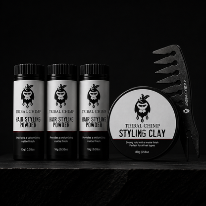 Tribal Chimp hair styling products including powder and clay on a black background